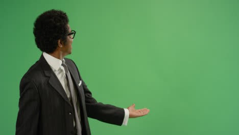 Businessman-gesturing-with-arms-on-green-screen